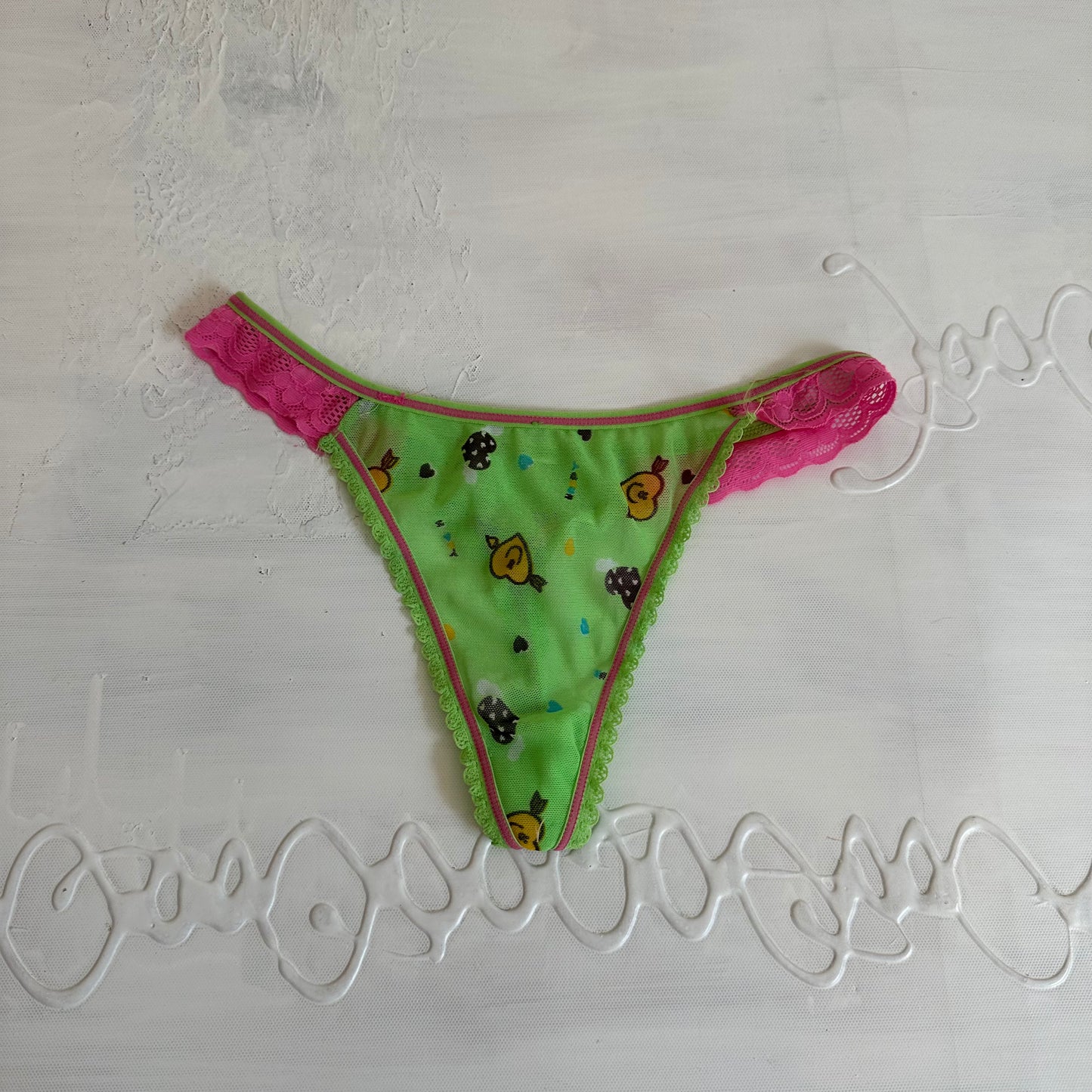 DAINTY DROP | green graphic mesh thong - small