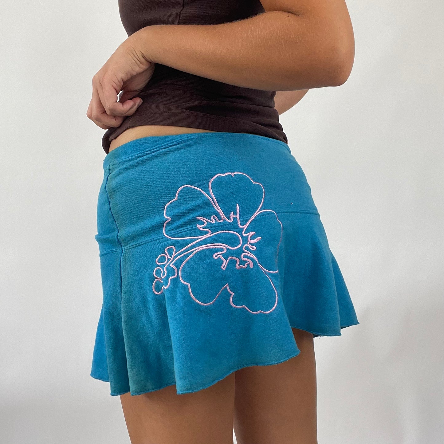 TROPICAL GIRL DROP | blue playboy mini skirt with pink hibiscus graphic - small