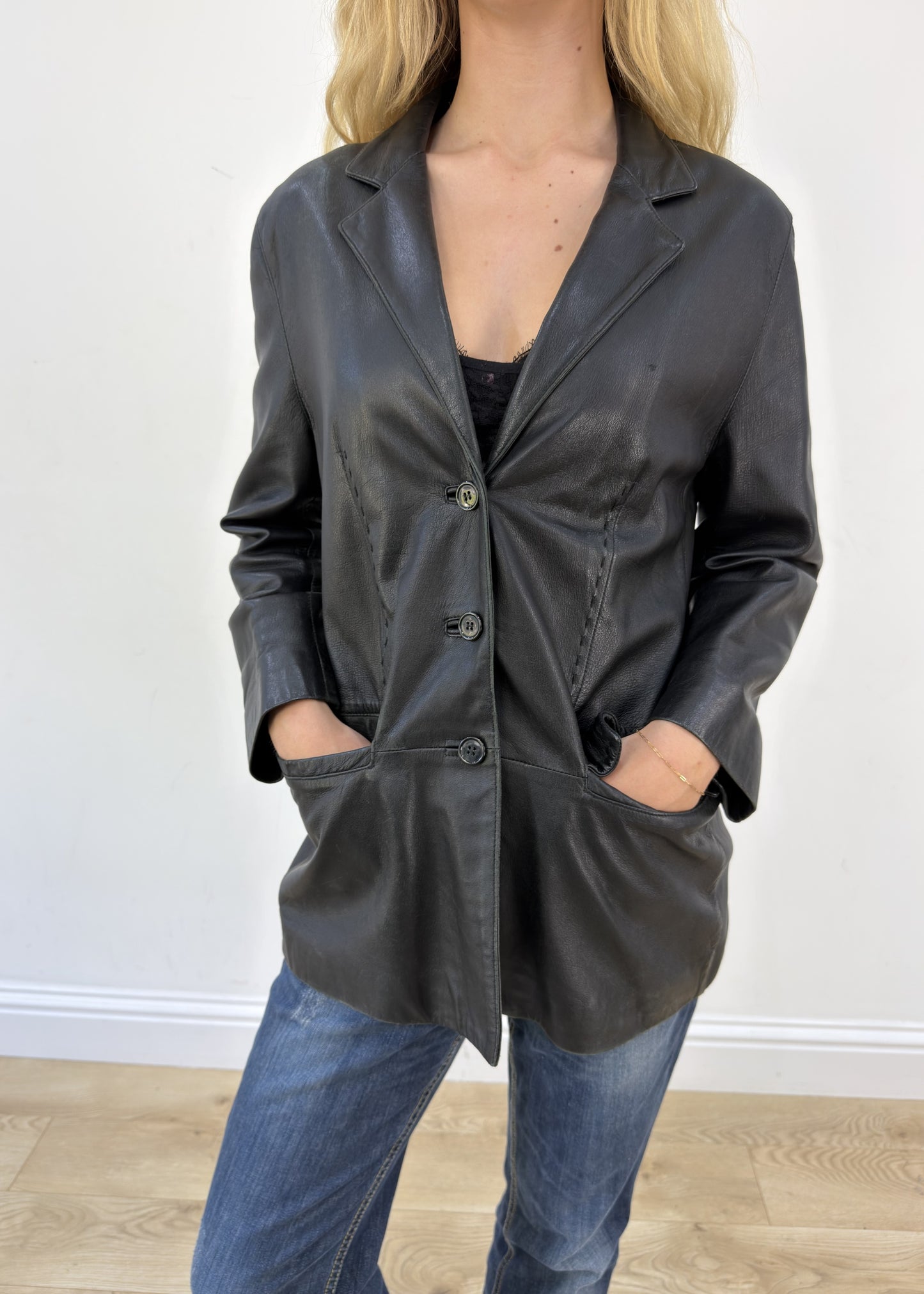 large black faux leather fitted jacket aesthetic close-up