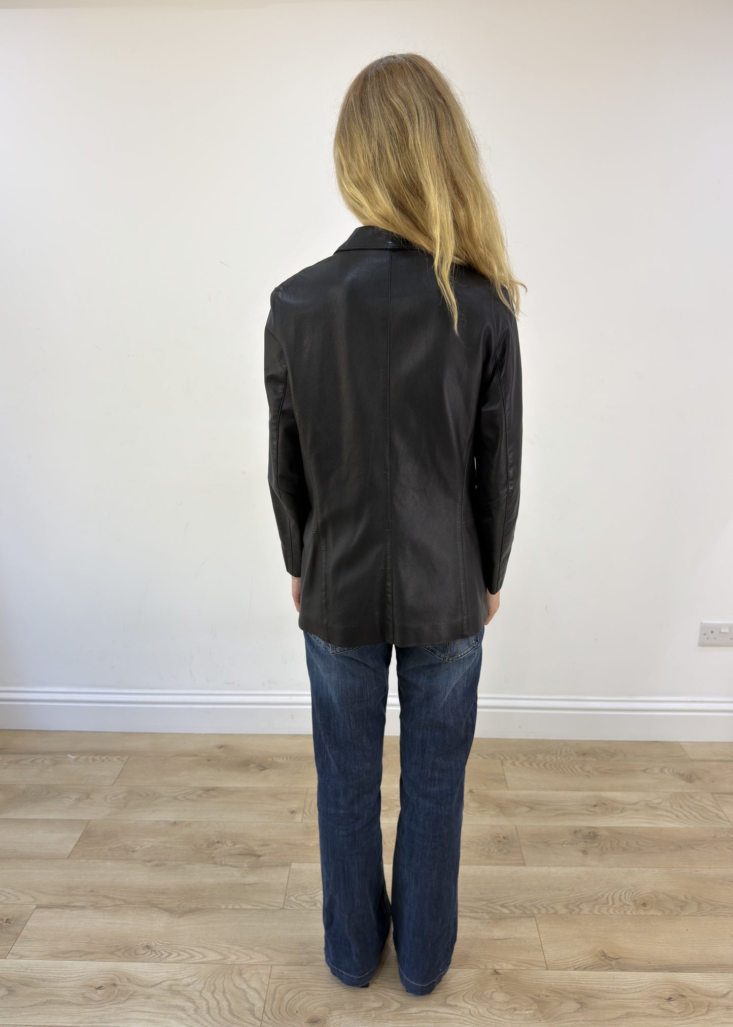 large black faux leather fitted jacket back view