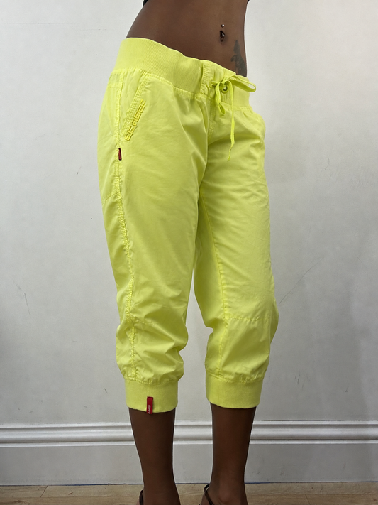 Neon green cropped joggers, steamed, angled view