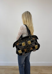 black fur patchwork shoulder bag worn on shoulder