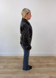 medium black glossy quilted jacket with embroidered back crest image 6