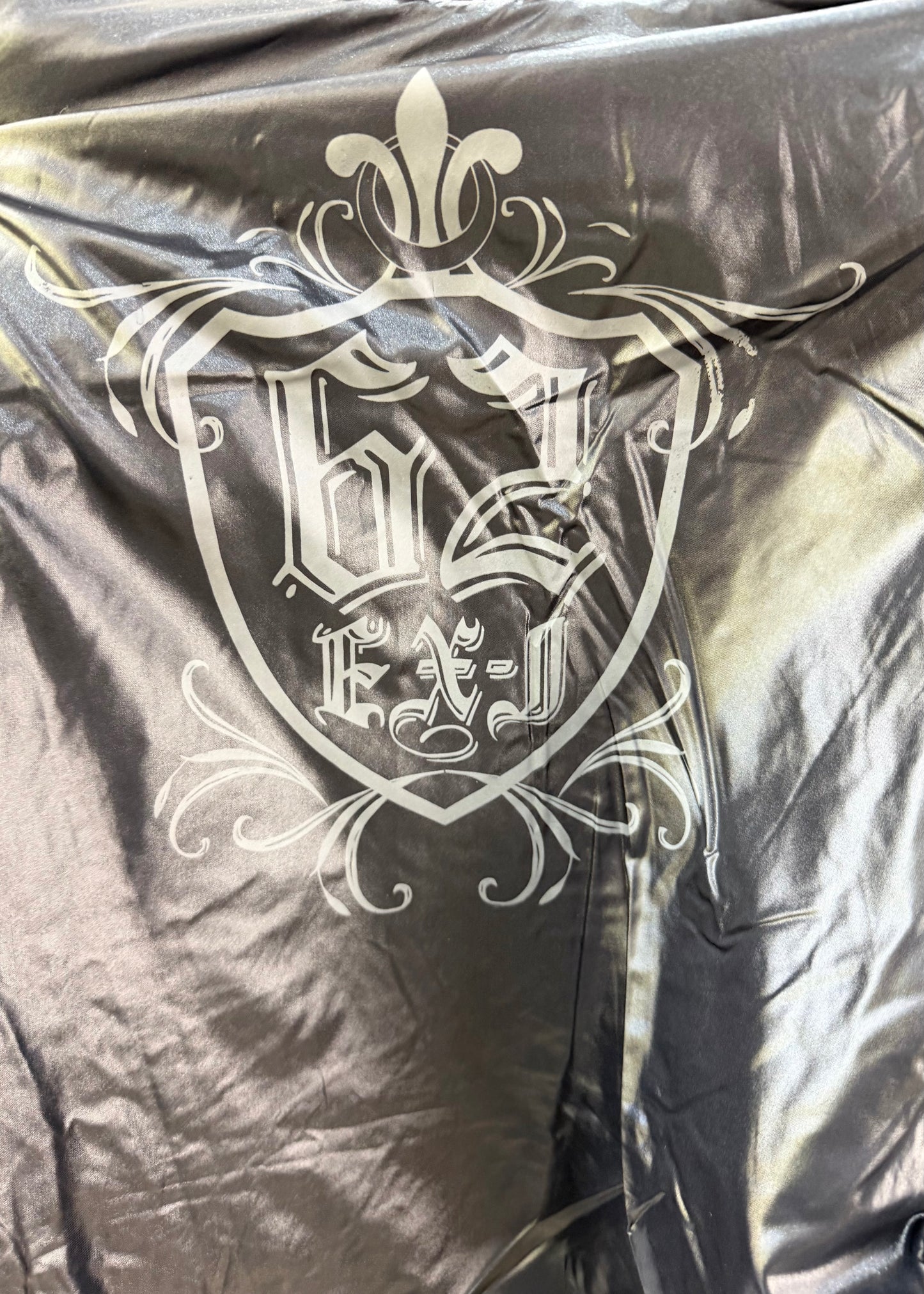medium black glossy quilted jacket with embroidered back crest image 8