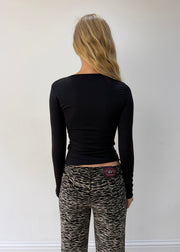 small black cutout-neckline long-sleeve top — photographed on Lily