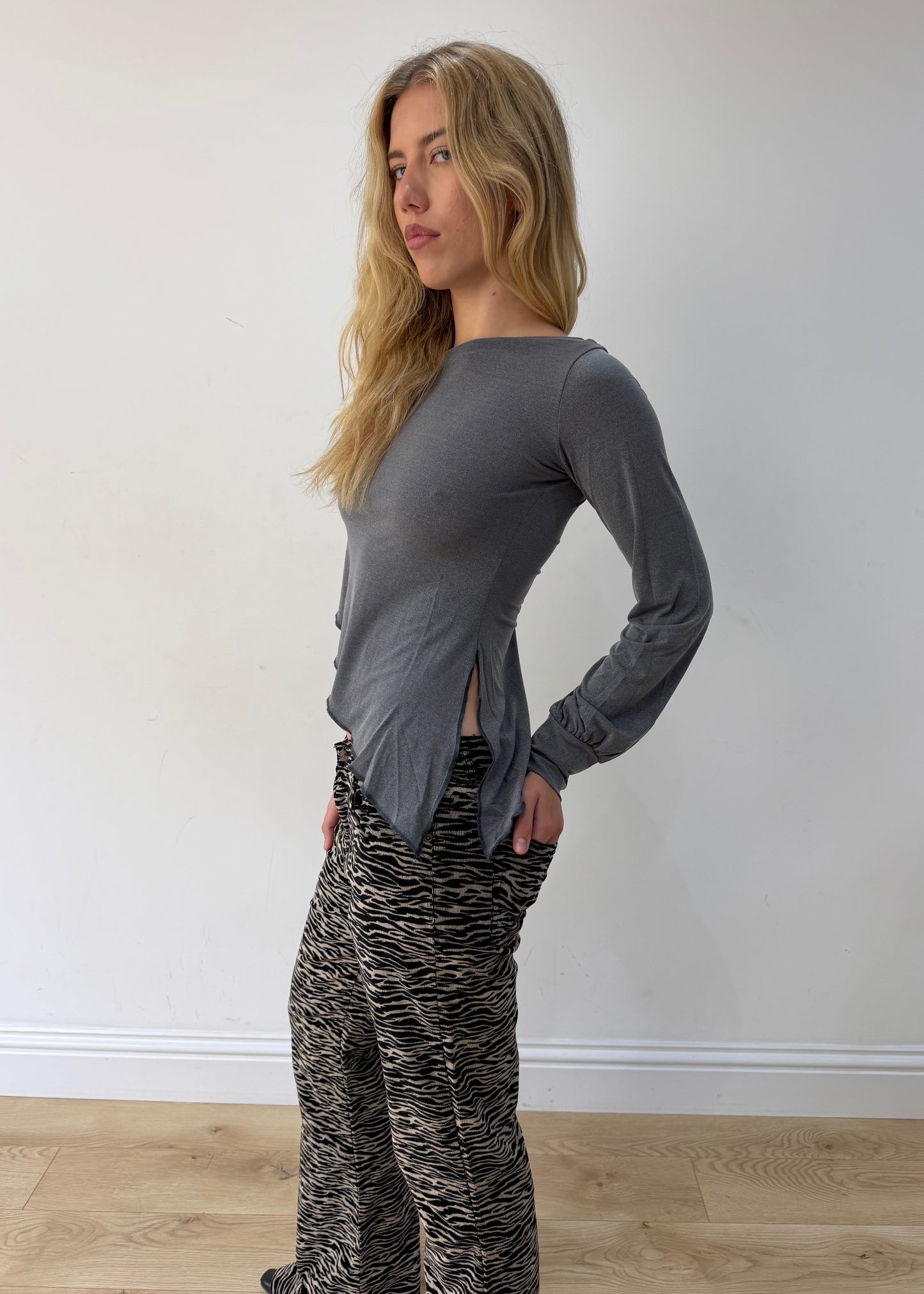 small grey asymmetric one-shoulder long-sleeve top — photographed on Lily