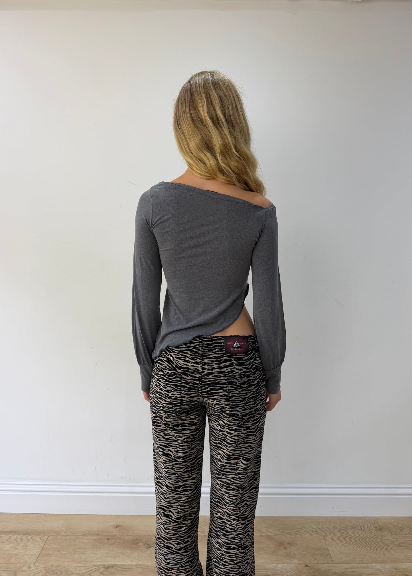 small grey asymmetric one-shoulder long-sleeve top — photographed on Lily