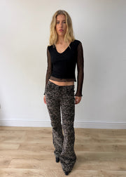 small black mesh ruffle-hem long-sleeve top — photographed on Lily