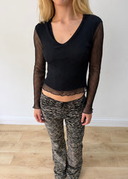 small black mesh ruffle-hem long-sleeve top — photographed on Lily