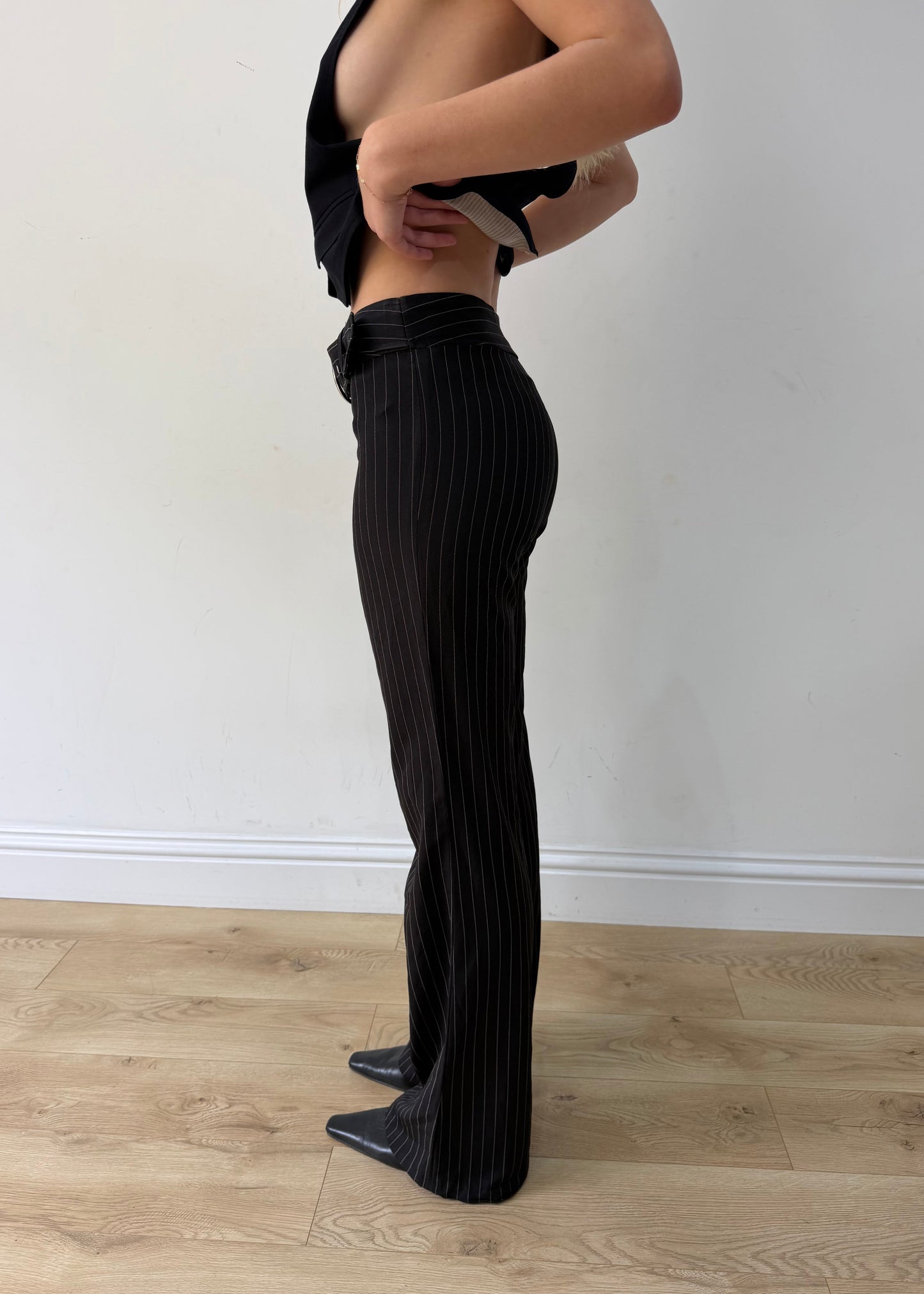 small black pinstripe buckle-belt flared trousers — photographed on Lily