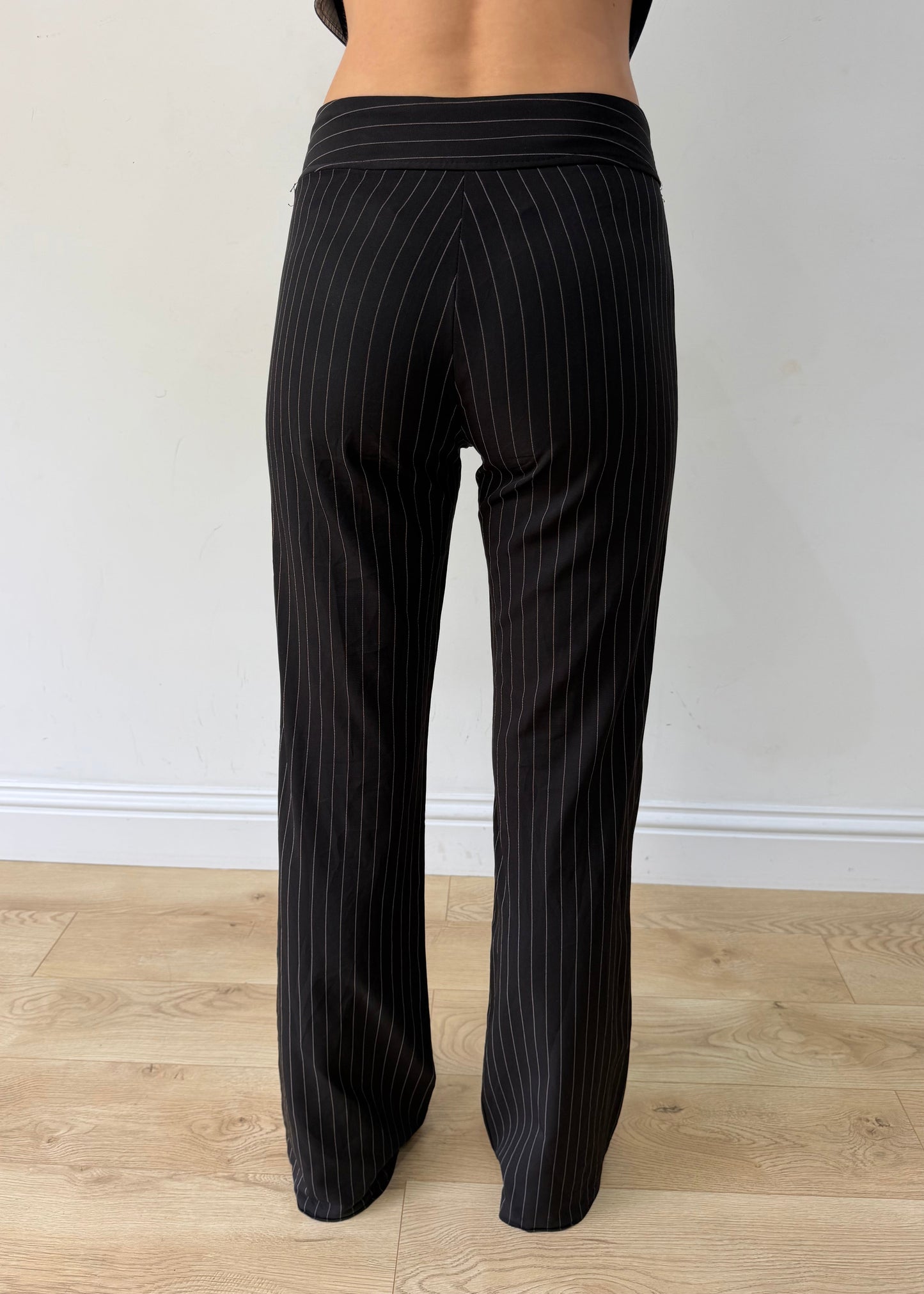 small black pinstripe buckle-belt flared trousers — photographed on Lily