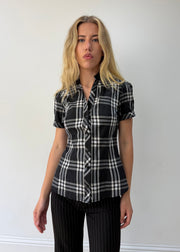 medium black and white plaid short-sleeve fitted shirt — photographed on Lily