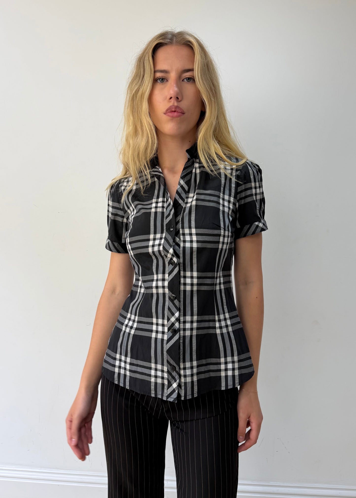 medium black and white plaid short-sleeve fitted shirt — photographed on Lily