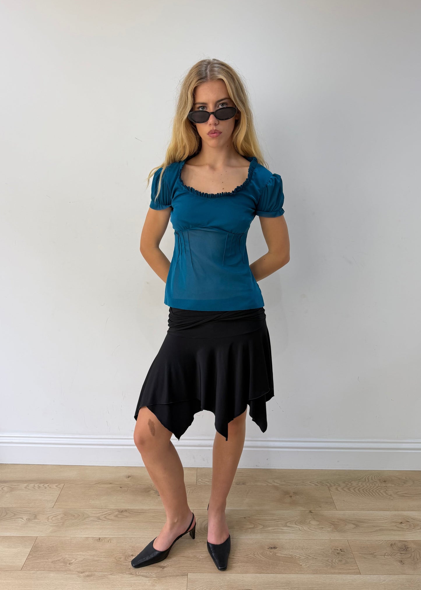 small black asymmetric handkerchief-hem skirt — photographed on Lily