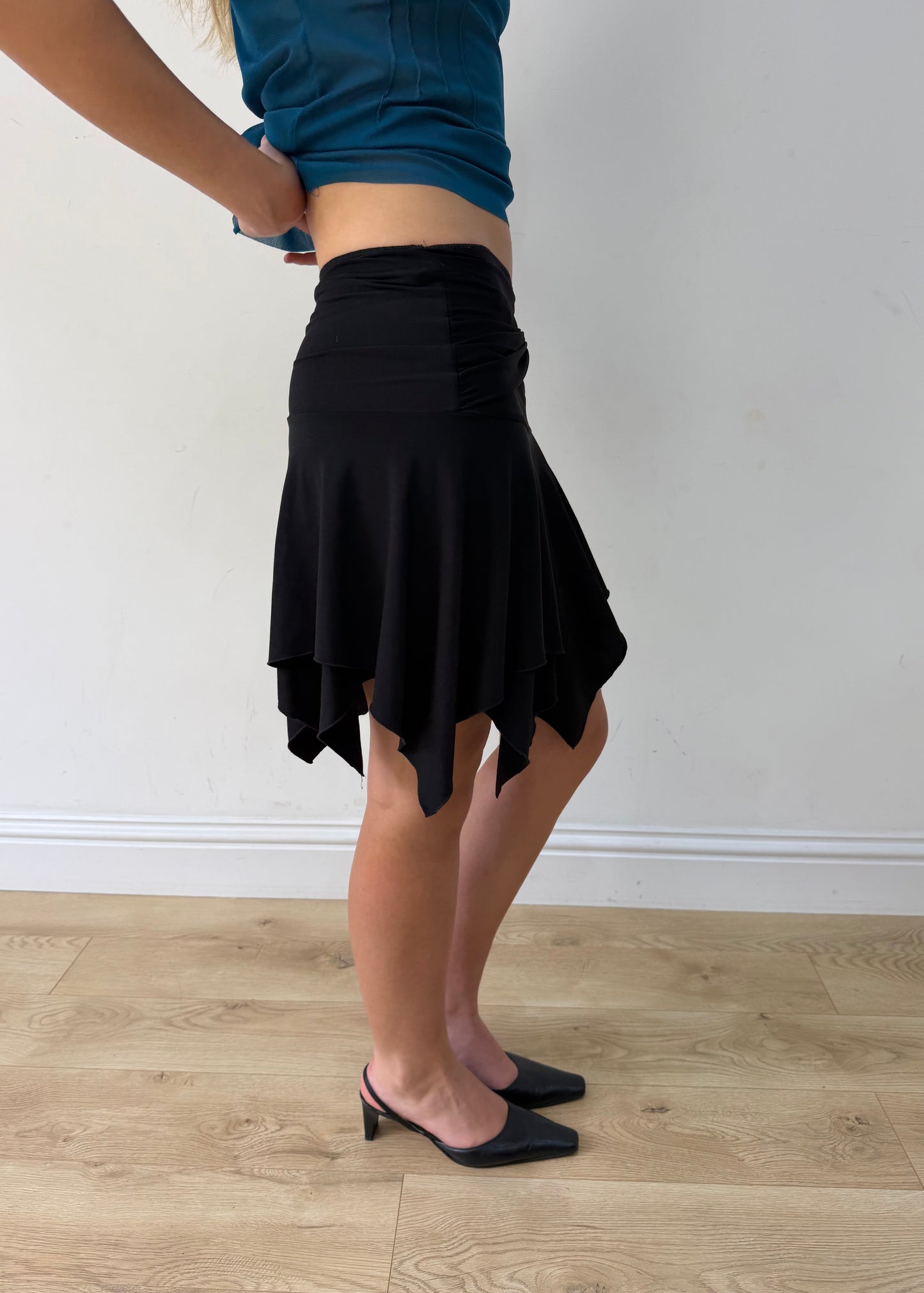 small black asymmetric handkerchief-hem skirt — photographed on Lily