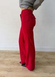 small red flap-pocket flared trousers — photographed on Lily