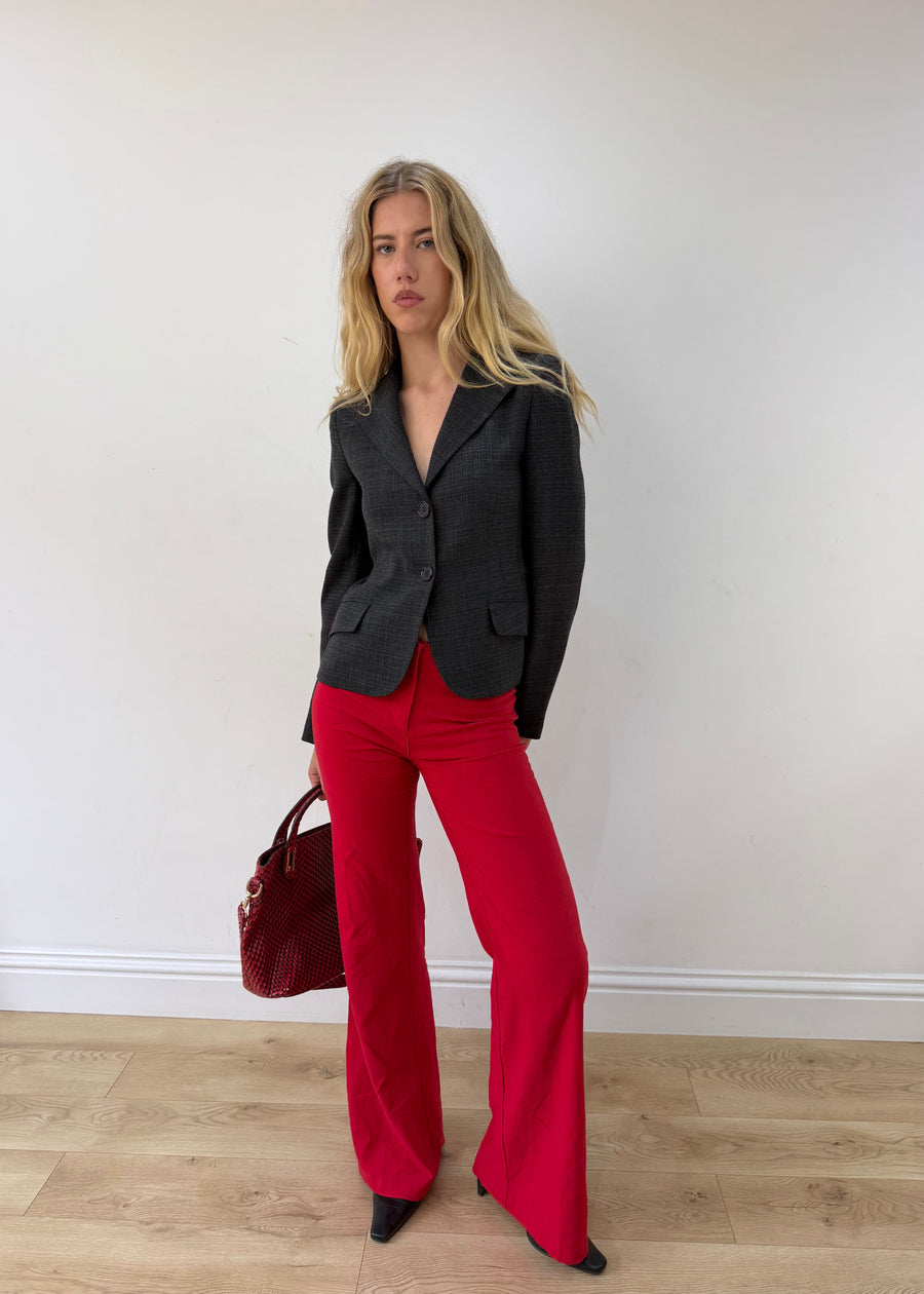small charcoal grey ruffle-hem fitted blazer — photographed on Lily