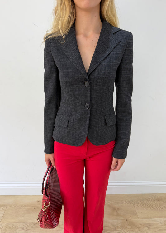 small charcoal grey ruffle-hem fitted blazer — photographed on Lily