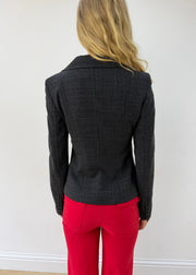 small charcoal grey ruffle-hem fitted blazer — photographed on Lily