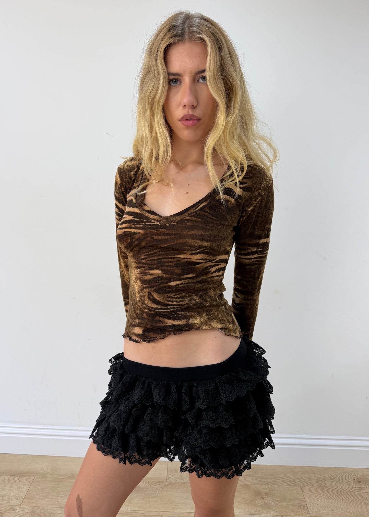 small brown zebra-print long-sleeve top — photographed on Lily