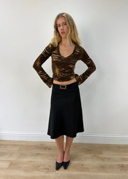 small black rhinestone-buckle midi skirt — photographed on Lily