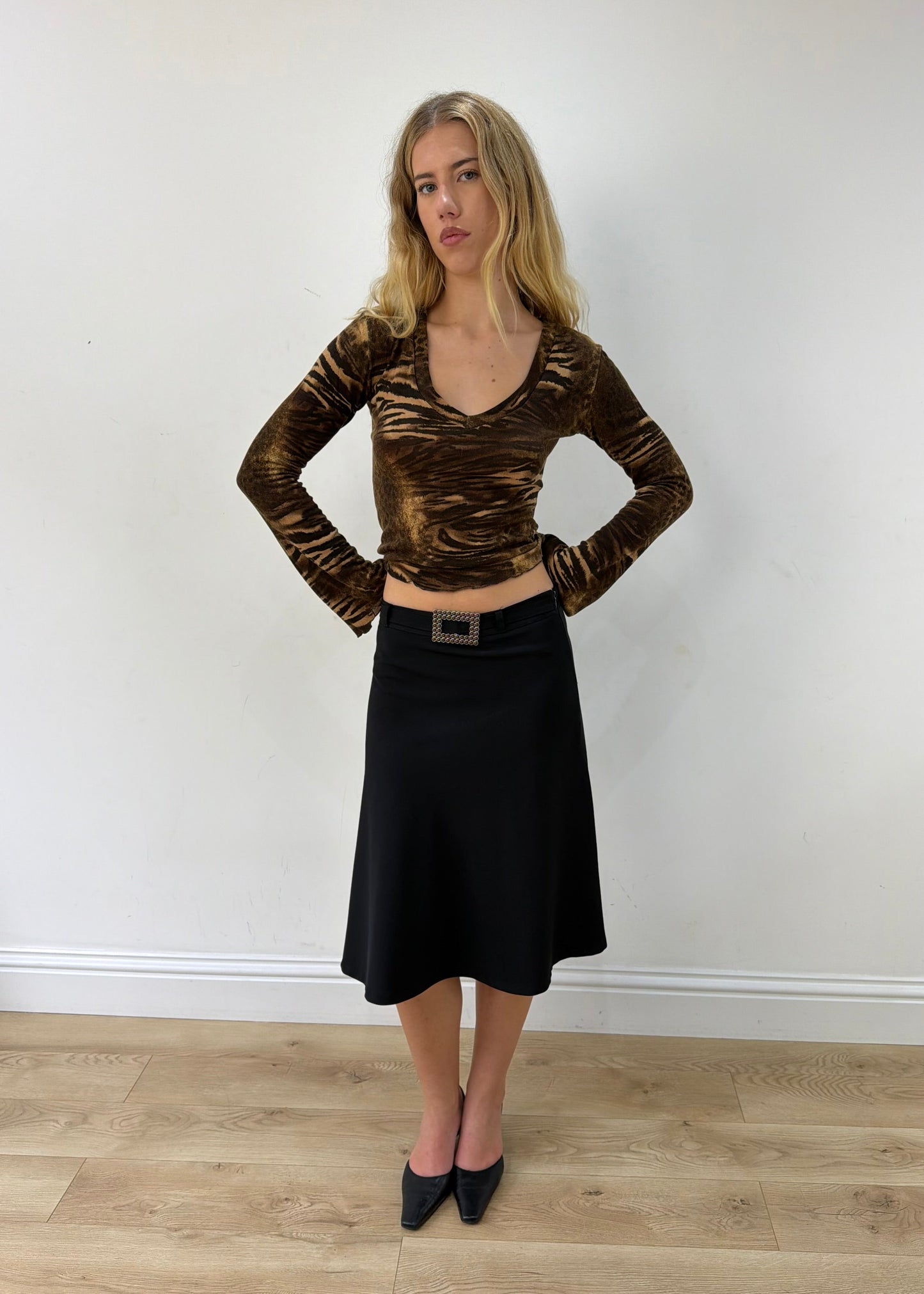 small black rhinestone-buckle midi skirt — photographed on Lily