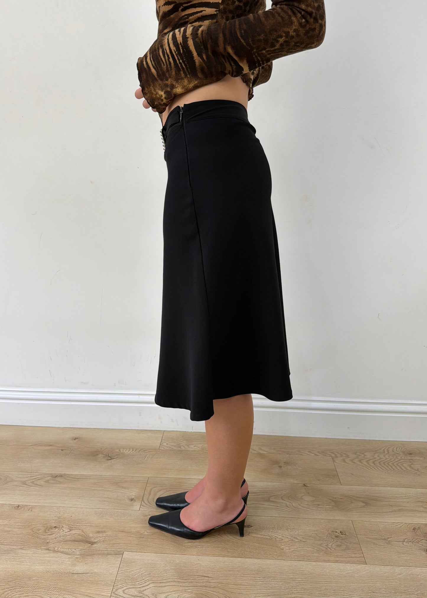 small black rhinestone-buckle midi skirt — photographed on Lily
