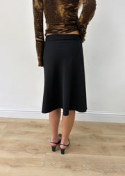 small black rhinestone-buckle midi skirt — photographed on Lily