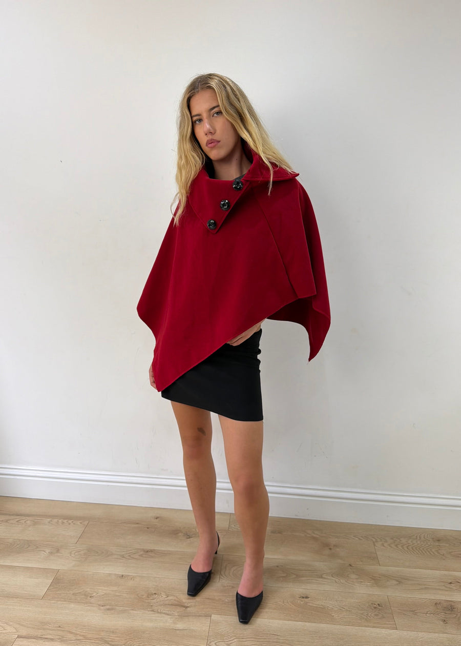 one size red button-detail asymmetric poncho — photographed on Lily