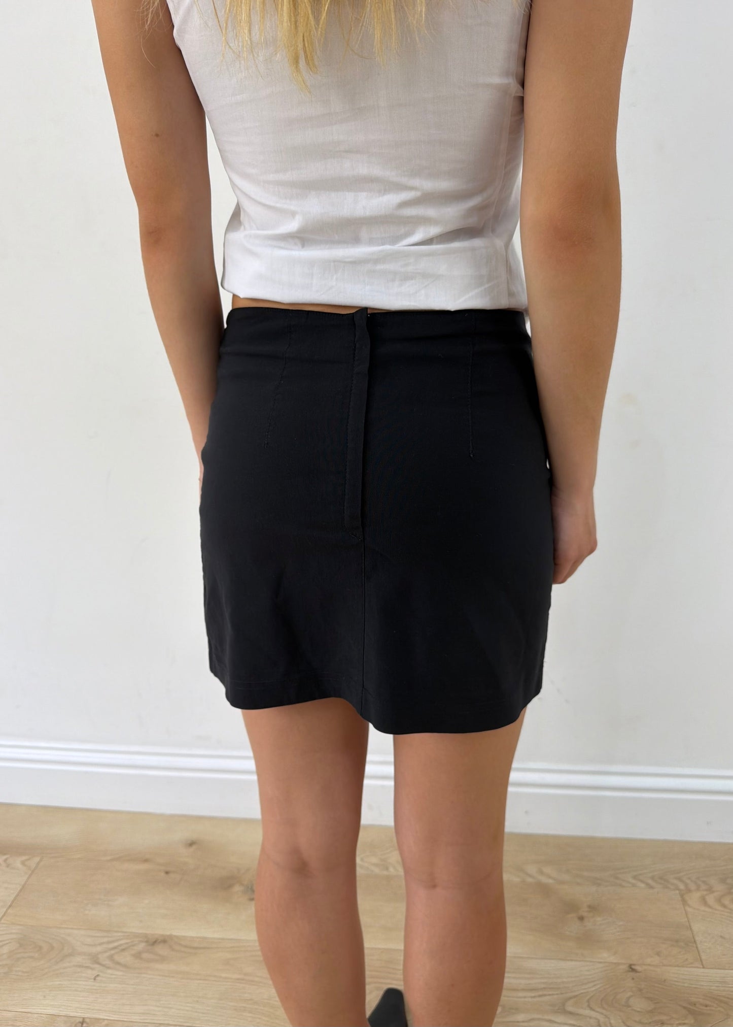 small black fitted tailored mini skirt — photographed on Lily