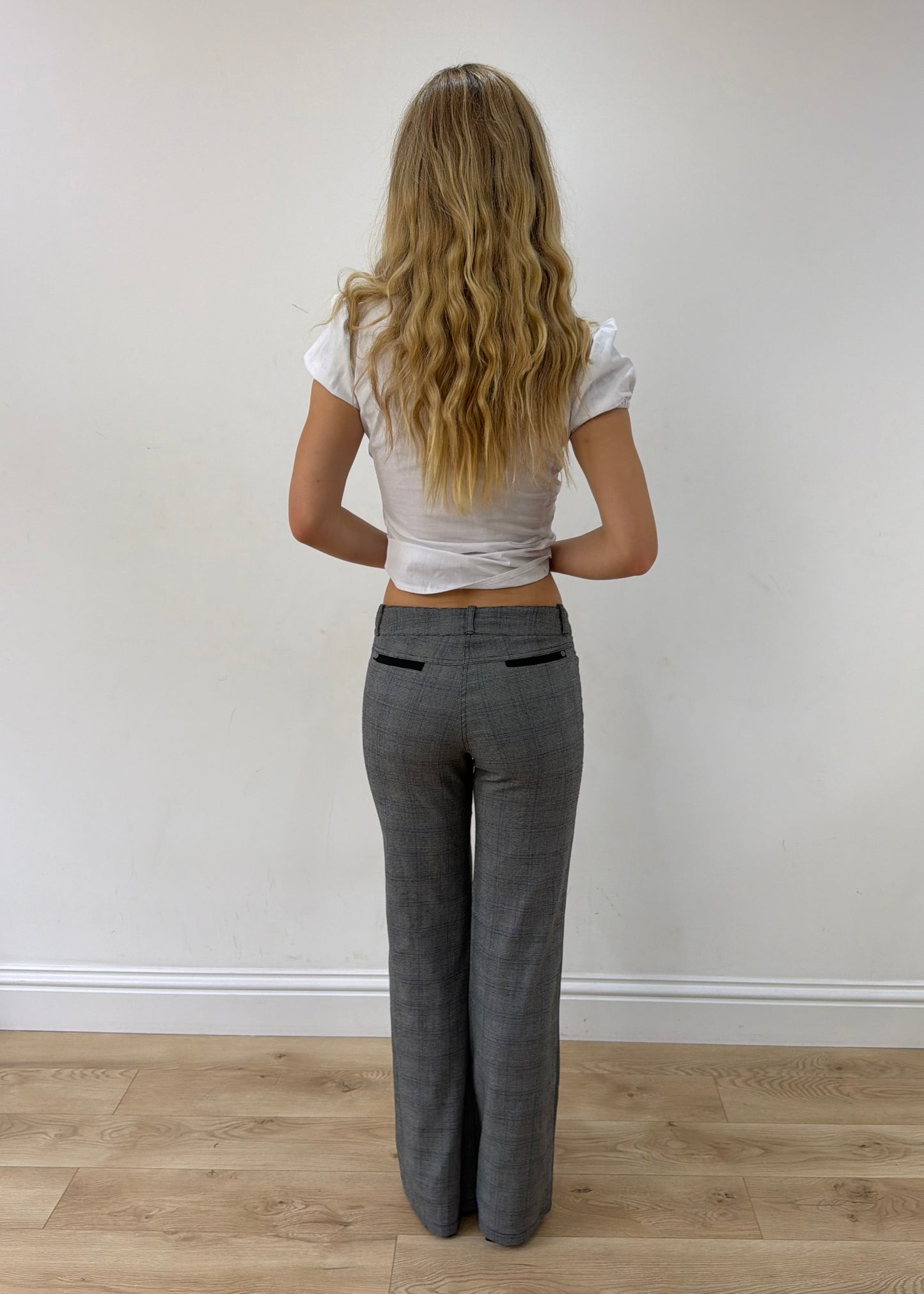 small grey check bootcut trousers — photographed on Lily