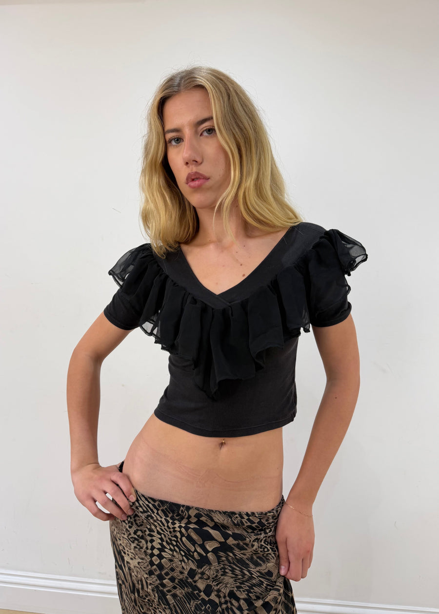 small black ruffle cropped short-sleeve top — photographed on Lily