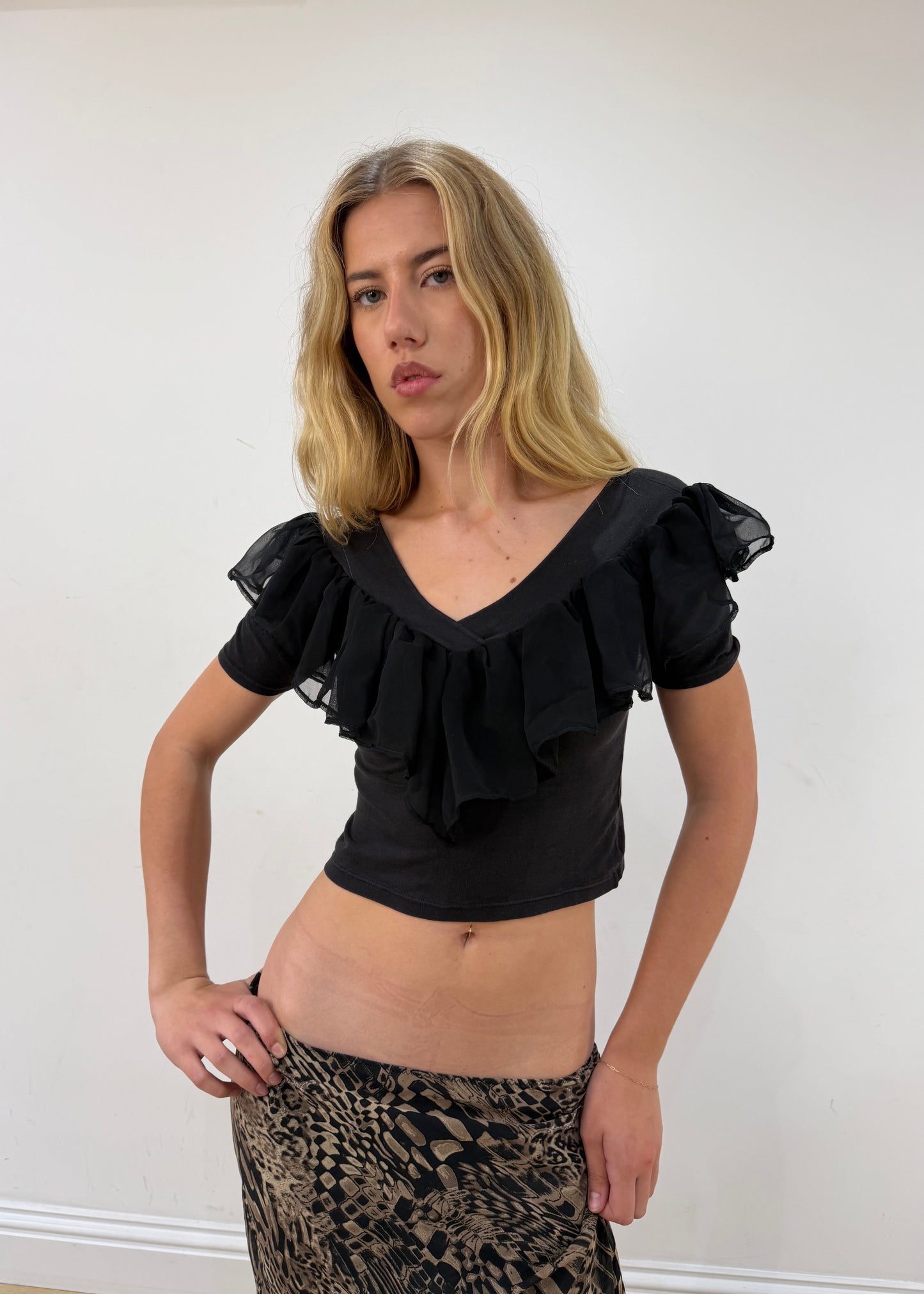 small black ruffle cropped short-sleeve top — photographed on Lily