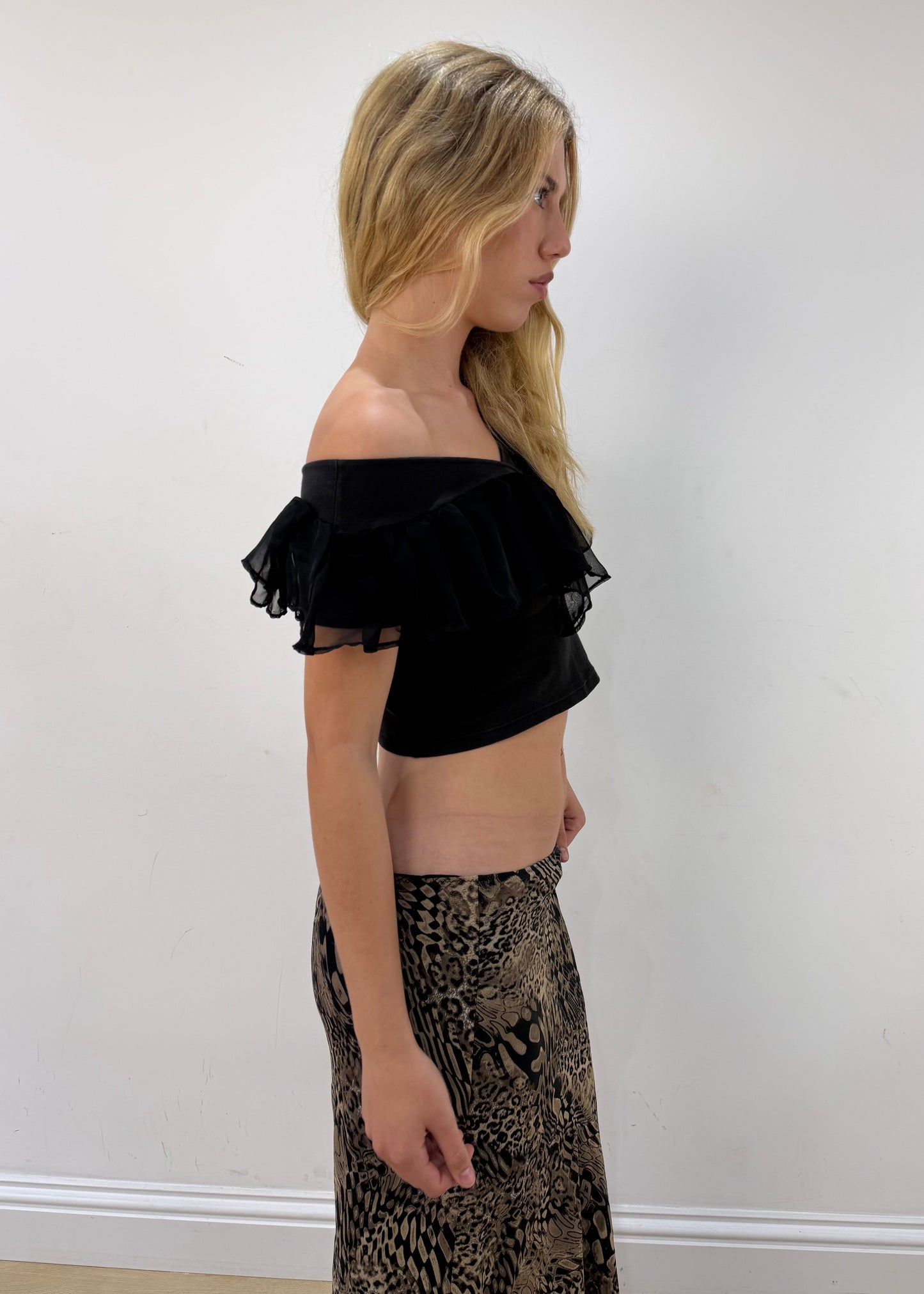 small black ruffle cropped short-sleeve top — photographed on Lily