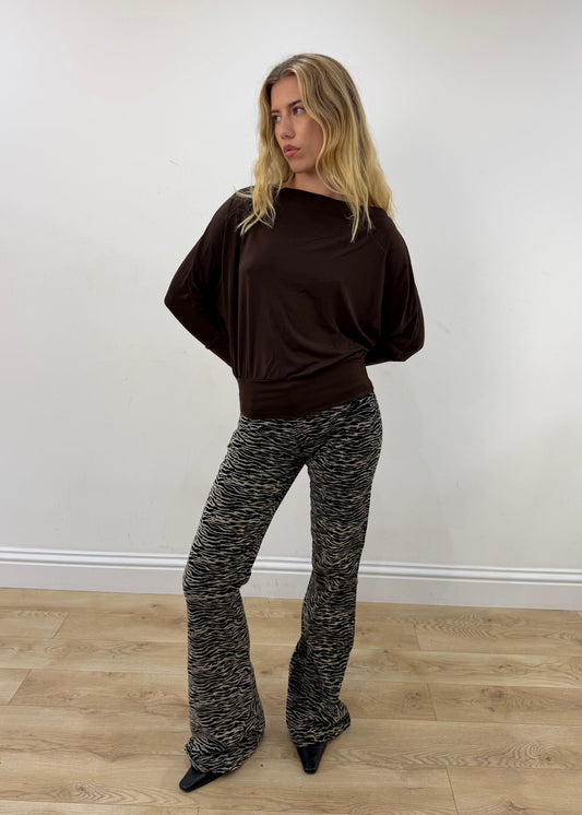 medium brown boat-neck long-sleeve top — photographed on Lily