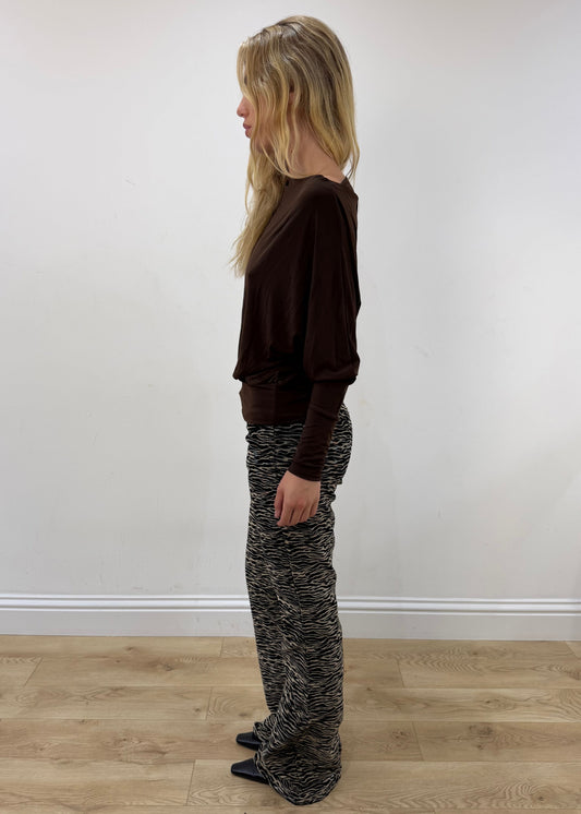 medium brown boat-neck long-sleeve top — photographed on Lily