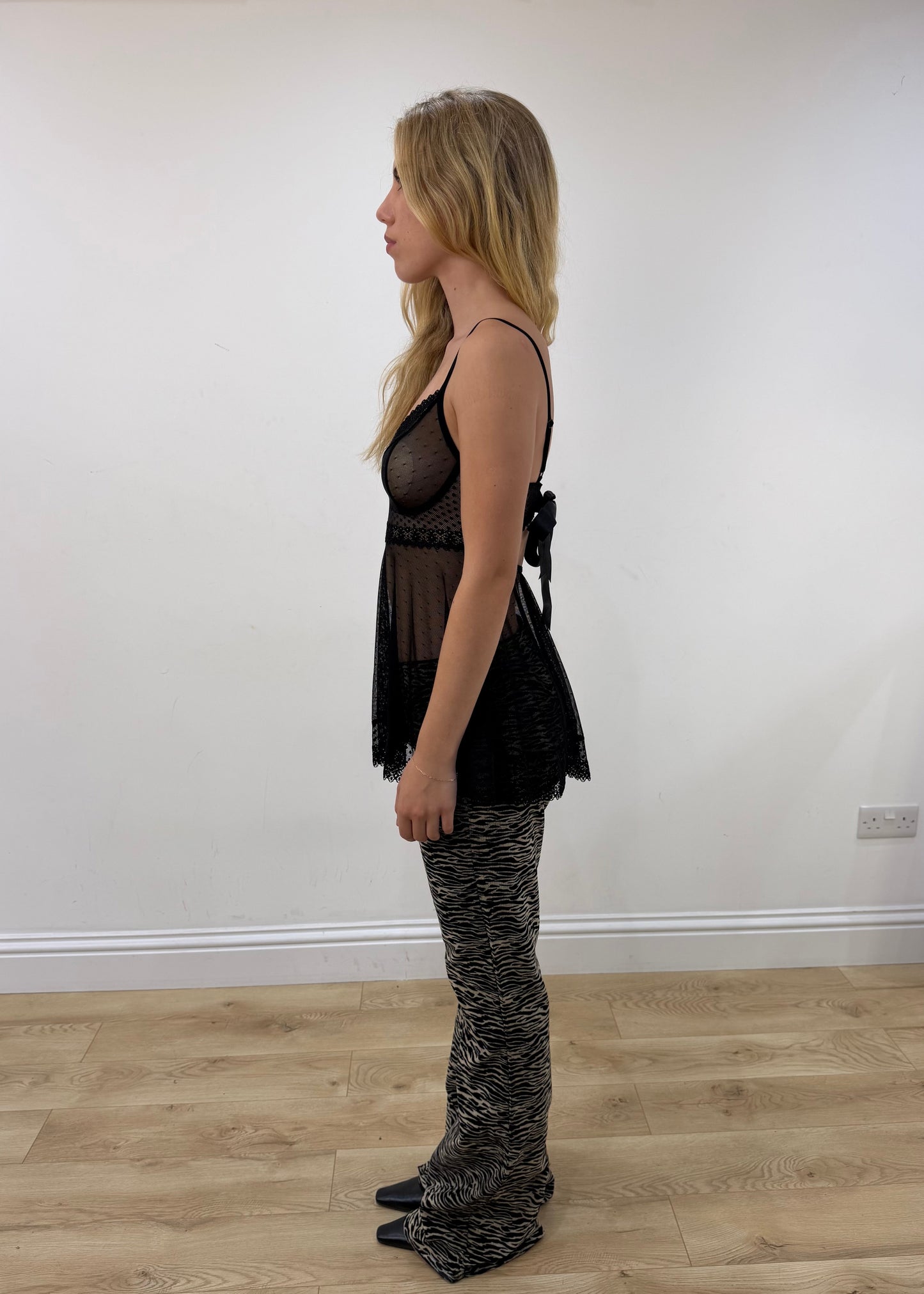 small black lace-trim babydoll mini dress — photographed on Lily