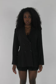 front view of black pinstripe single-button blazer