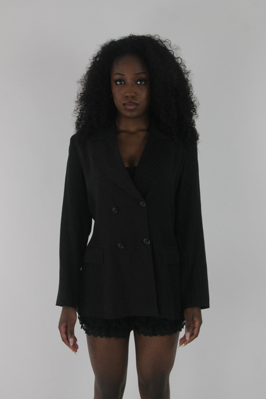 front view of black pinstripe single-button blazer