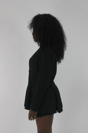 side view of black pinstripe single-button blazer
