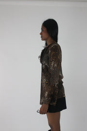 alternate-side view of brown paisley-print sheer asymmetric tunic top