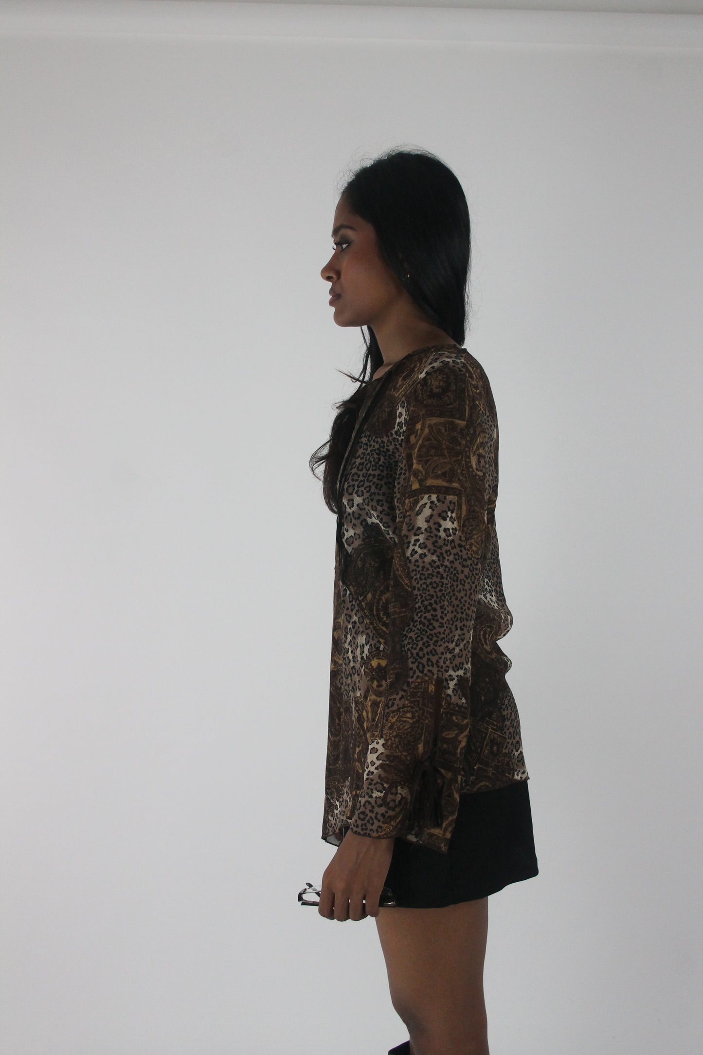 alternate-side view of brown paisley-print sheer asymmetric tunic top