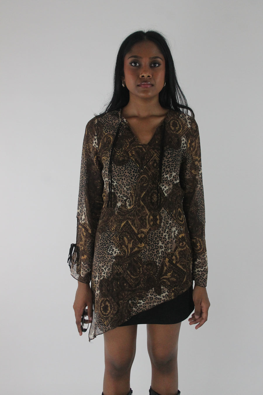 front view of brown paisley-print sheer asymmetric tunic top