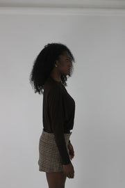 alternate-side view of dark brown boat-neck long-sleeve top