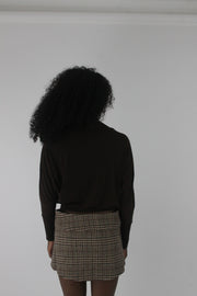 back view of dark brown boat-neck long-sleeve top