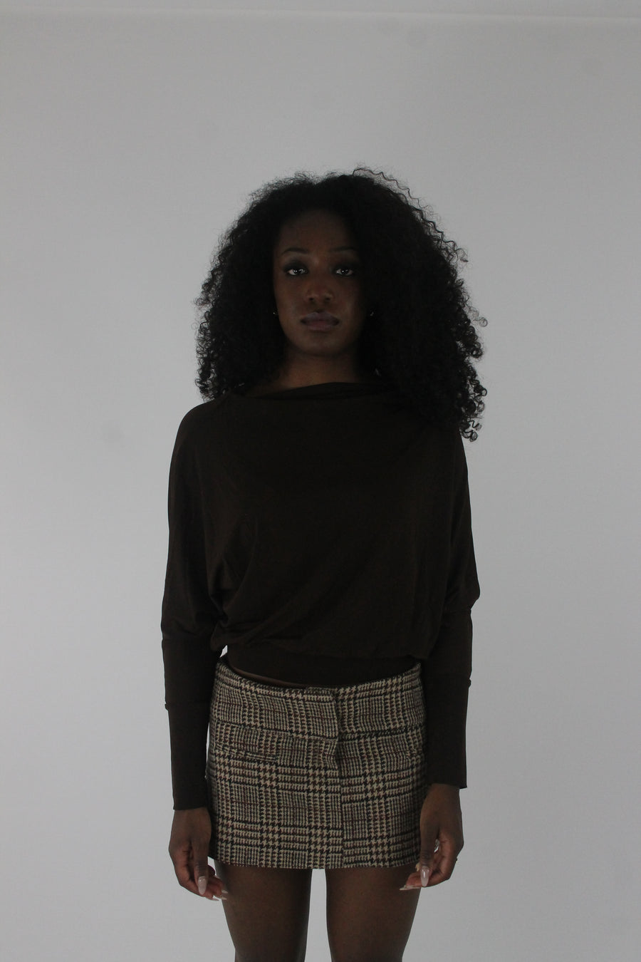 front view of dark brown boat-neck long-sleeve top