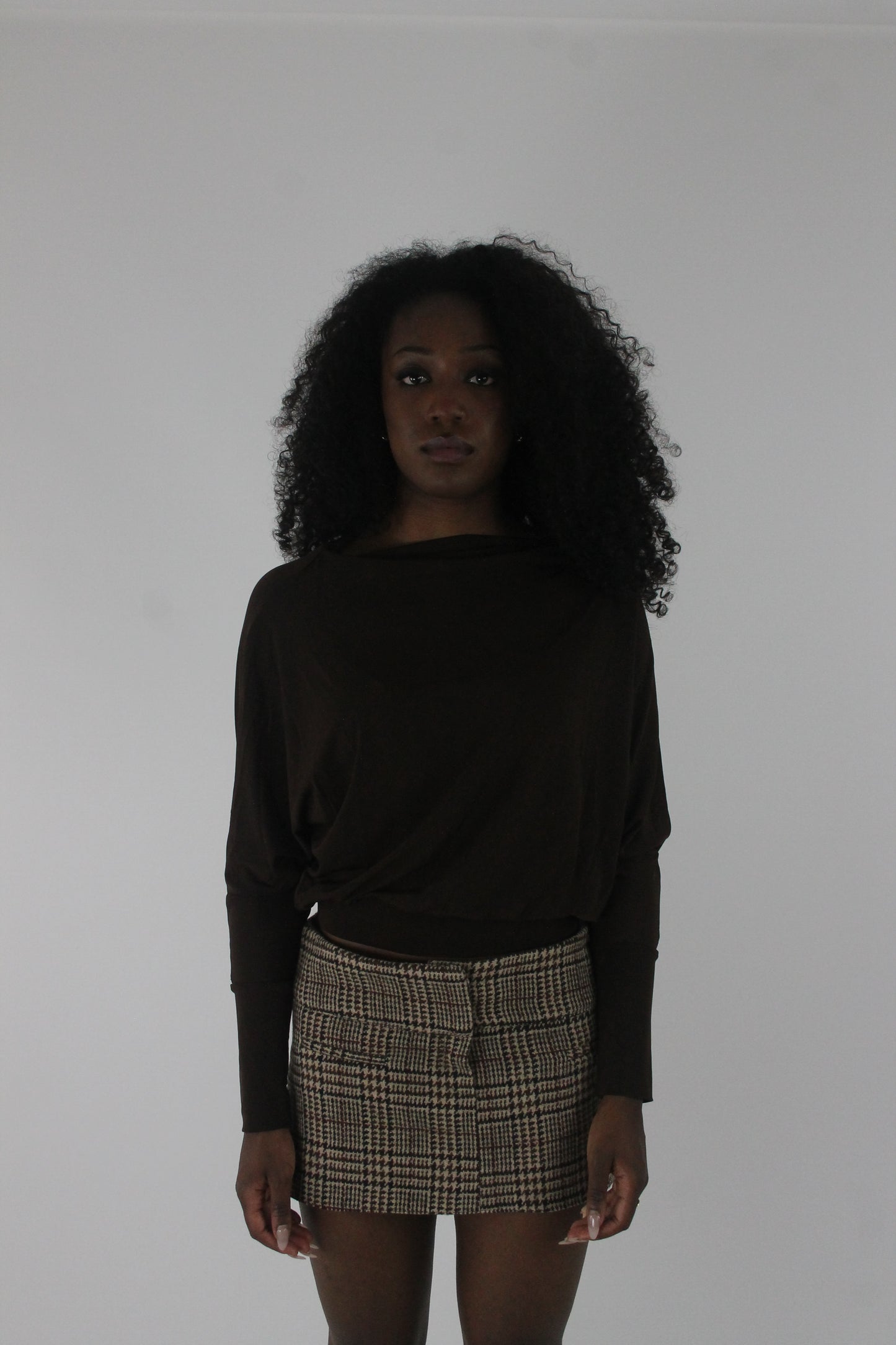 front view of dark brown boat-neck long-sleeve top