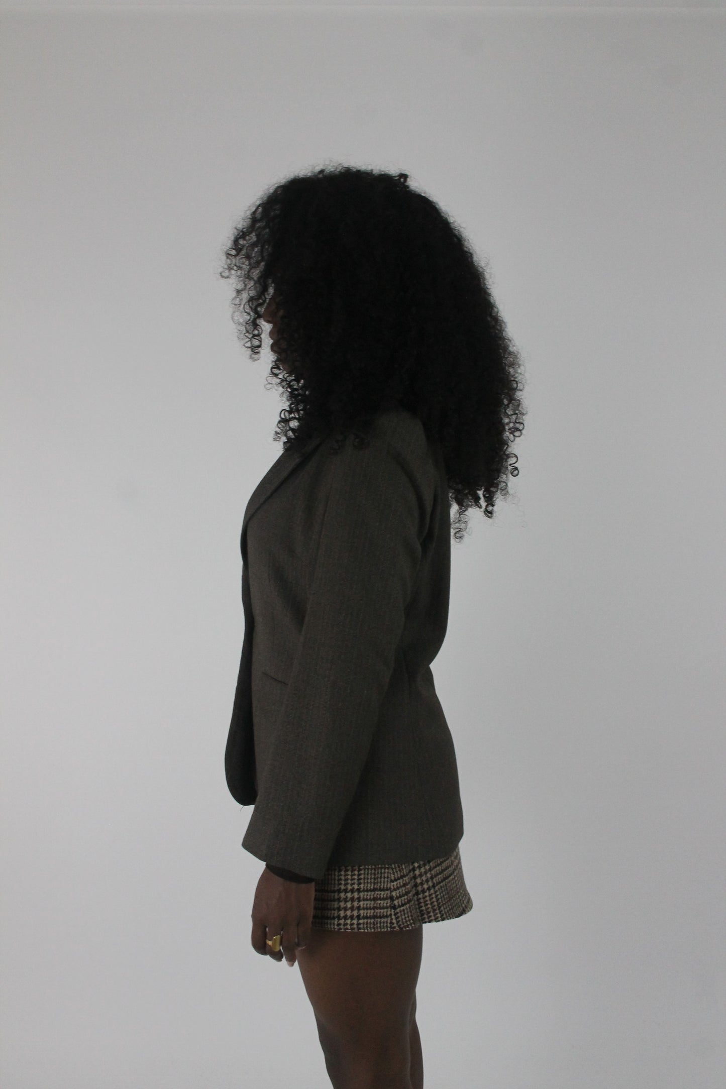 side view of dark olive single-button blazer