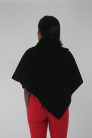 back view of black button-detail asymmetric poncho