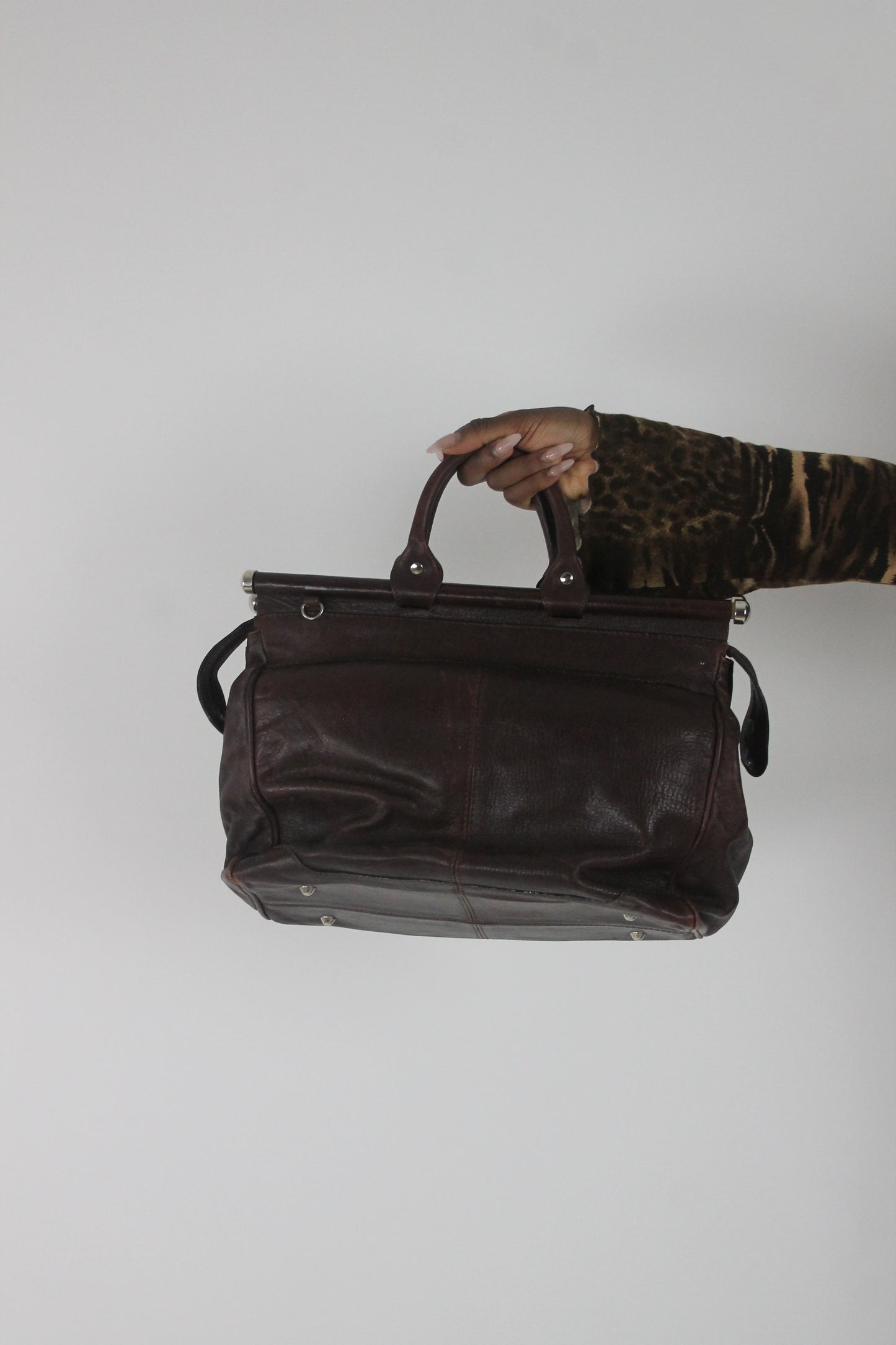 back view of dark brown structured handbag